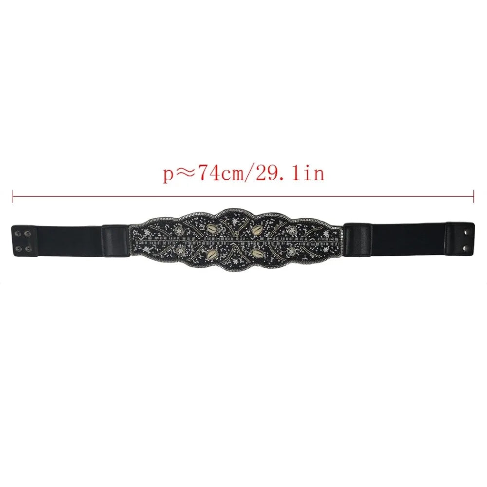 Black elastic boho flower waist belt for women with beaded floral centre panel and snap closures by Luxurymania24