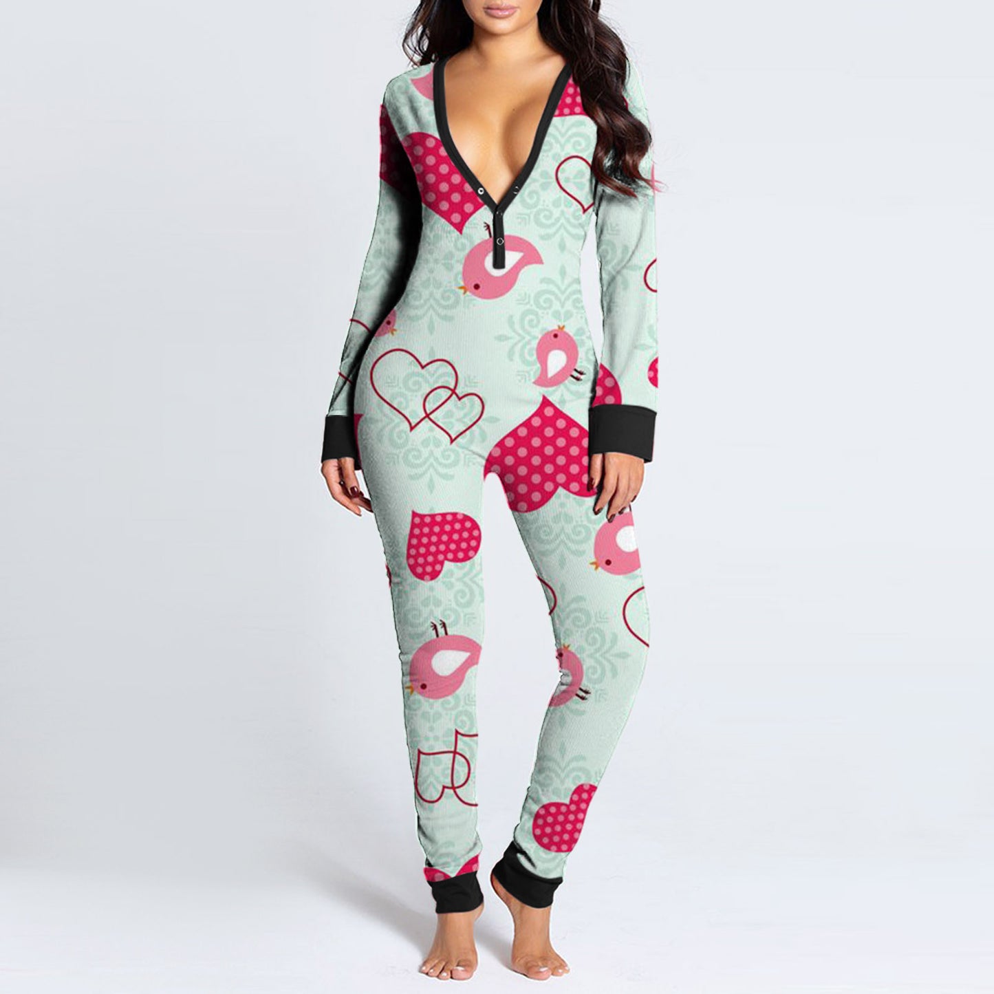 Luxurymania24 model wearing mint and pink patterned fun buttoned flap overalls sleep suit with black trim and deep V neck