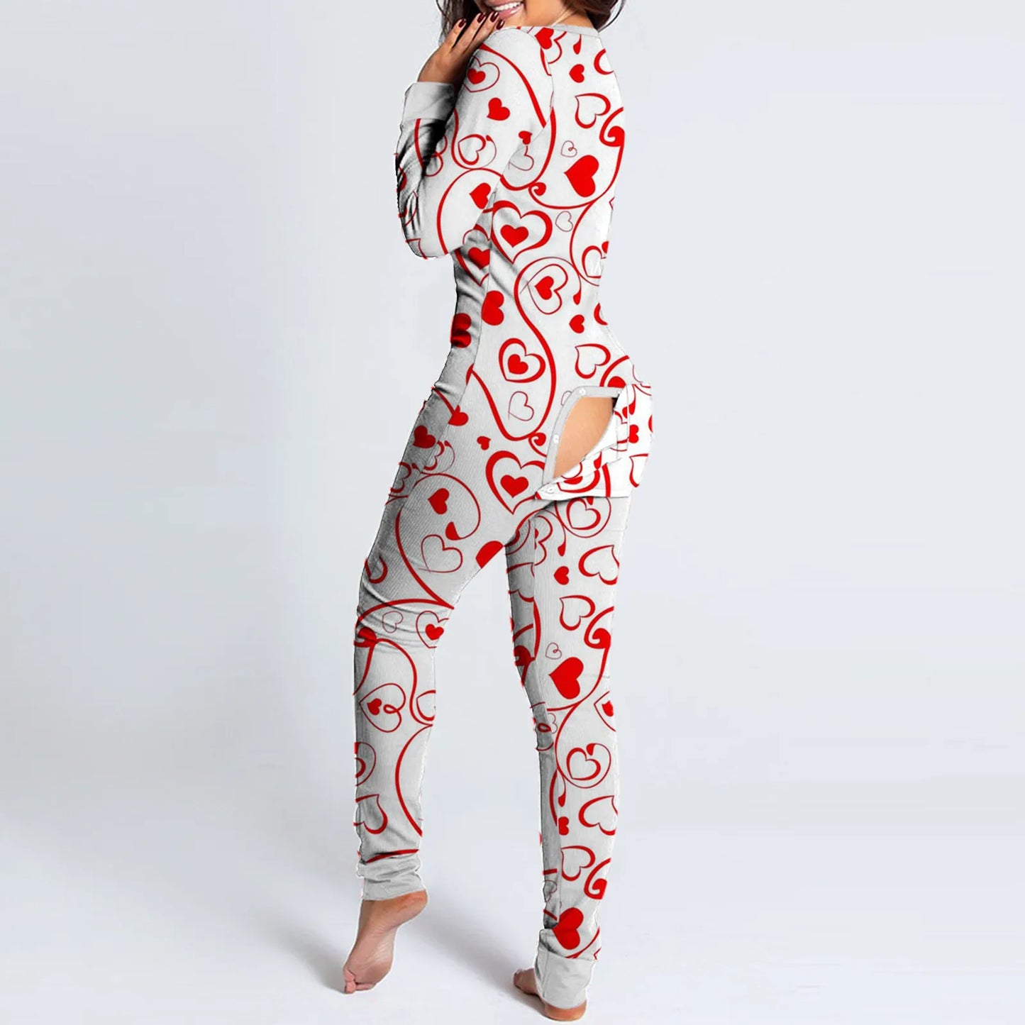 Woman wearing white onesie with red heart print and rear buttoned flap by Luxurymania24 fun buttoned flap overalls sleep suit