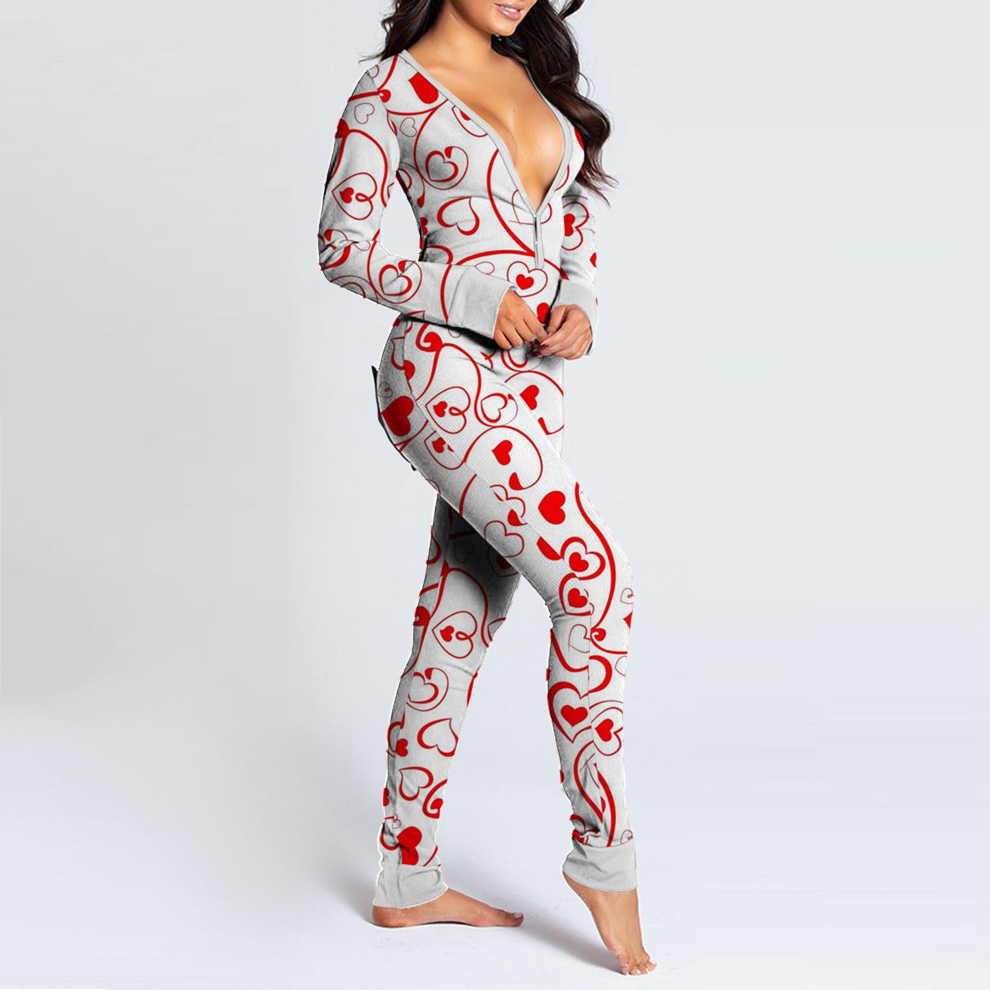 Woman in grey heart print fun buttoned flap overalls sleep suit with deep V neckline and long sleeves