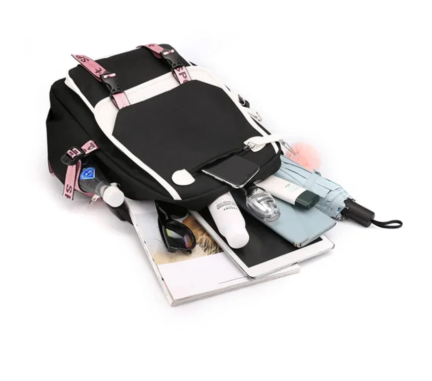 Kawaii School Backpack For Girls black backpack with white trim pink straps and pom pom keychain with tablet and umbrella