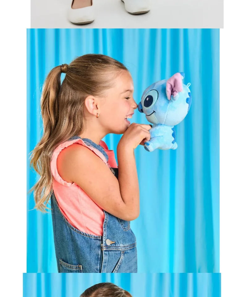 Smiggle school bag set for girls campaign image of a girl holding a blue plush toy wearing denim dungarees
