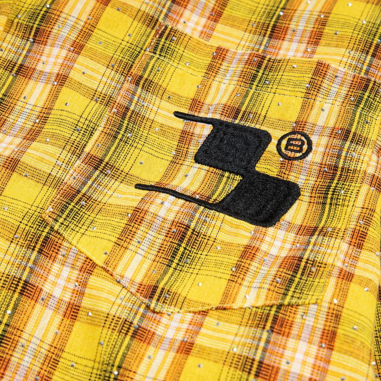 Street Style Diamond Embroidery Shirt close up of yellow plaid pocket with black embroidered logo and crystals
