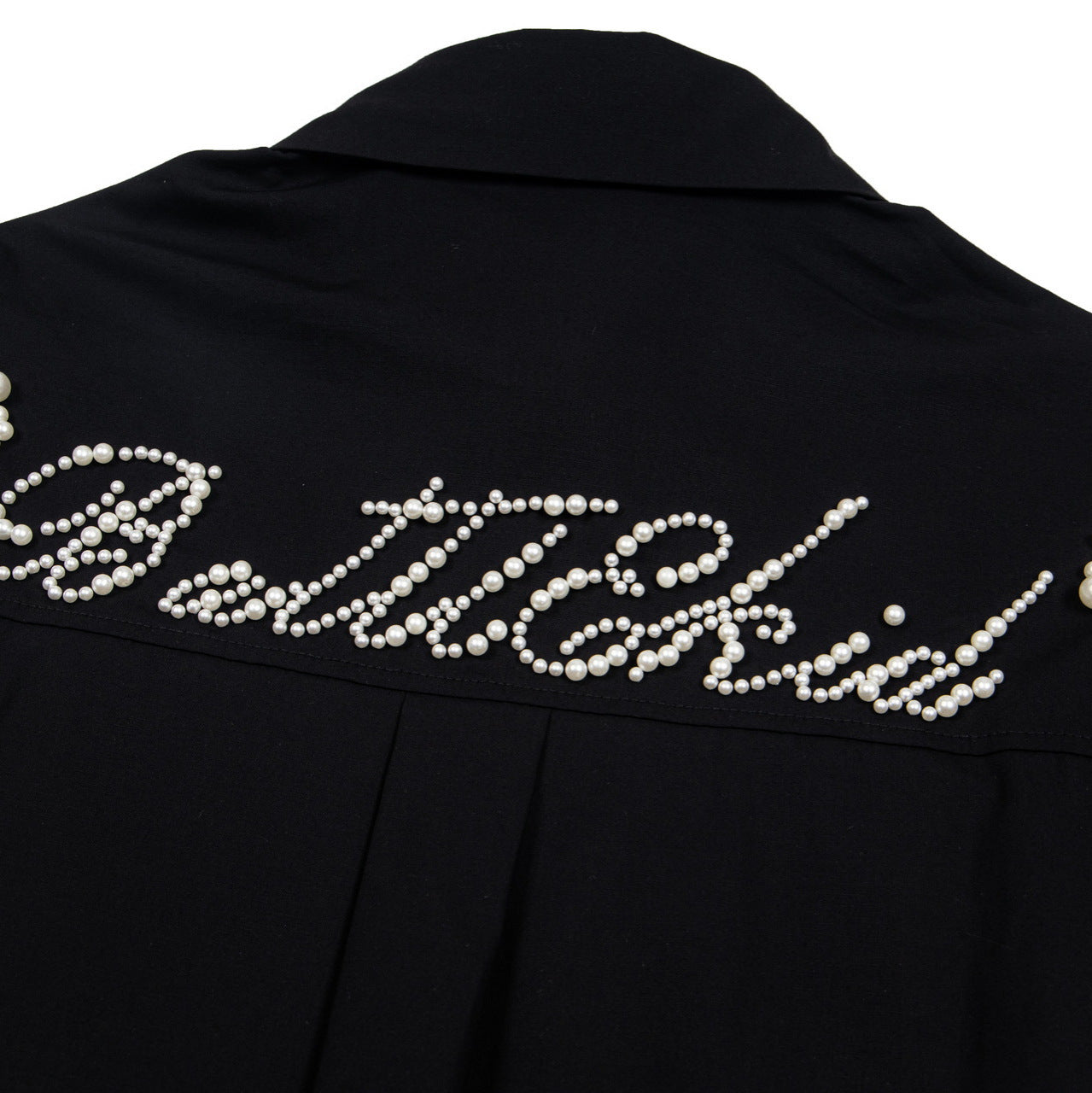 Black eprolo shirt back with pearl bead script across yoke offering an elevated street style beaded shirt look
