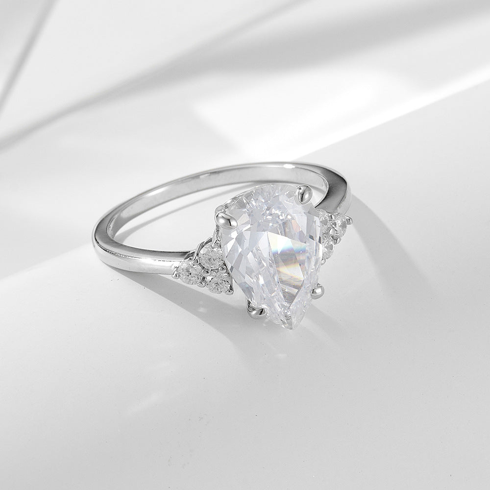 Luxurymania24 pear shaped VVS1 Moissanite Ring For Women with raindrop design and side accent stones on silver band