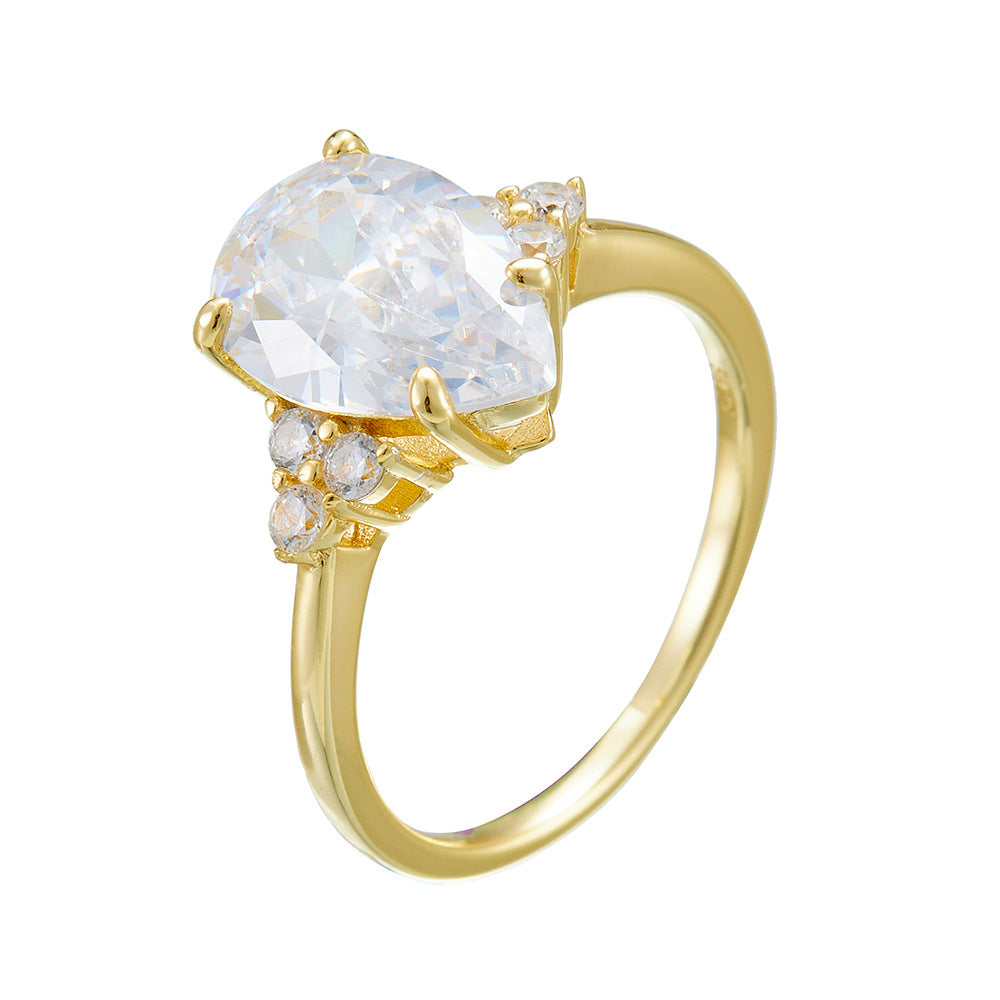 Luxurymania24 pear drop VVS1 Moissanite Ring For Women in yellow gold with side stones and polished band