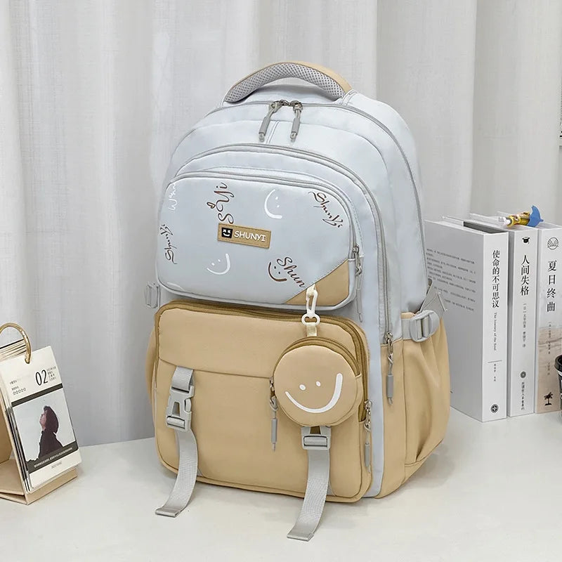 Light grey and beige padded school bag with smiley pouch and moon print primary school backpack for girls