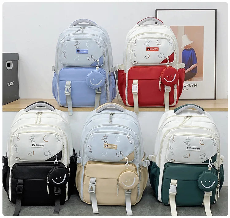 Set of six colourful primary school backpack for girls in red blue black beige green and white with smiley pouch and moon print