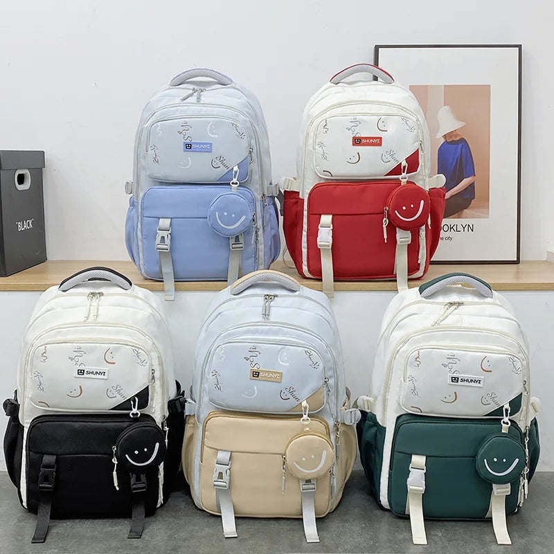 Assorted primary school backpack for girls in red blue black beige and green with moon print and smile pouch