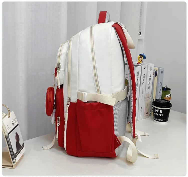 White and red primary school backpack for girls with multiple compartments adjustable straps and side mesh pocket