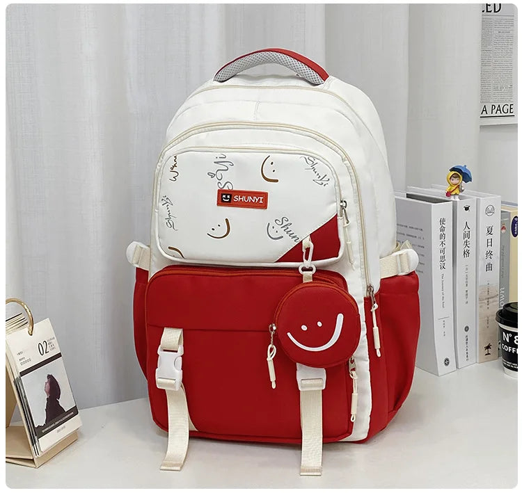 White and red smiley design primary school backpack for girls with front pocket side pockets and round coin pouch