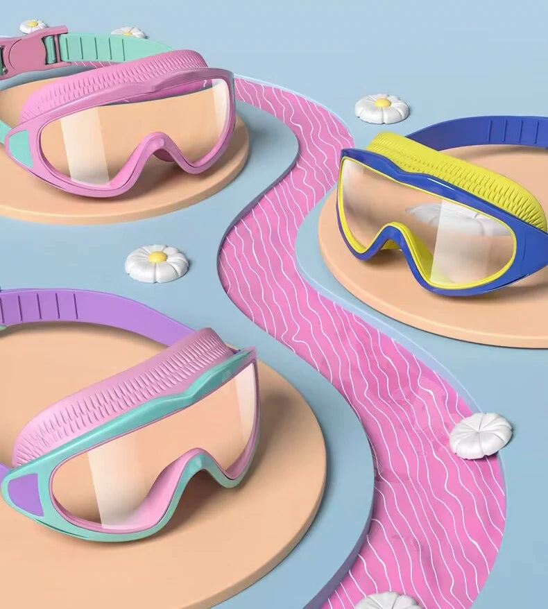 UV protection kids pool goggles in pink, blue, and purple with adjustable straps displayed on decorative plates