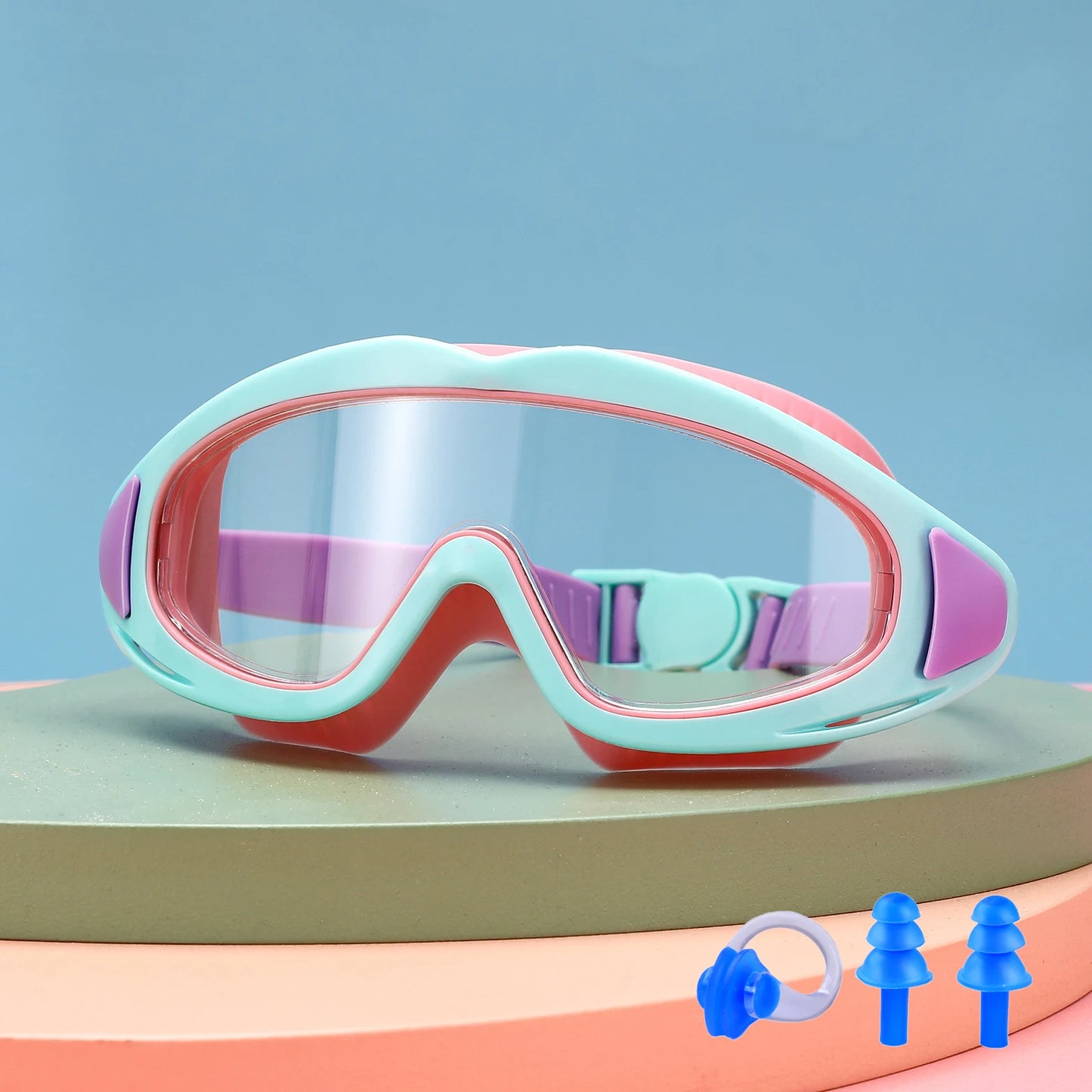 UV protection kids pool goggles in pastel colours with adjustable strap and ear plugs for swimming safety