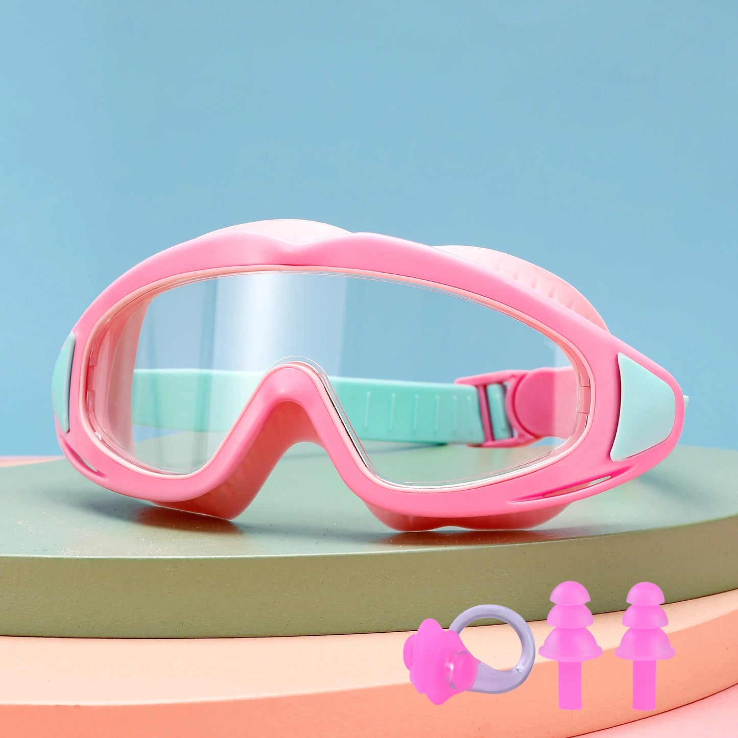 Pink UV protection kids pool goggles with adjustable strap and earplugs for safe swimming