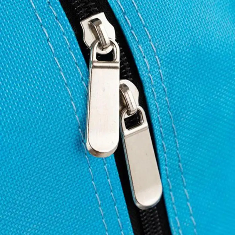 Close up of turquoise waterproof inline skates bag zip pulls and reinforced stitched seam by Luxurymania24