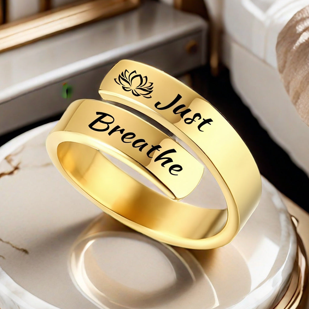 Eprolo gold wrap ring with lotus motif and script Just Breathe on band for mindful wear just breathe engraved ring