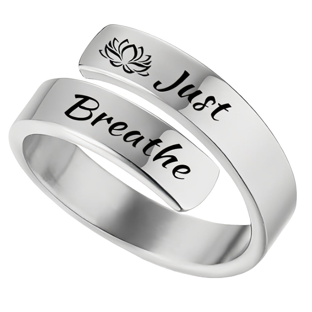 Silver wraparound ring with lotus motif and Just Breathe engraving for calm wearable reminder just breathe engraved ring
