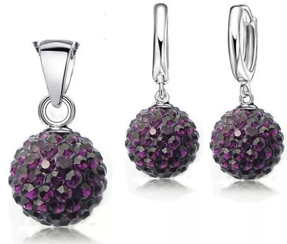 Jewelry set with purple ball pendant and earrings on a white background