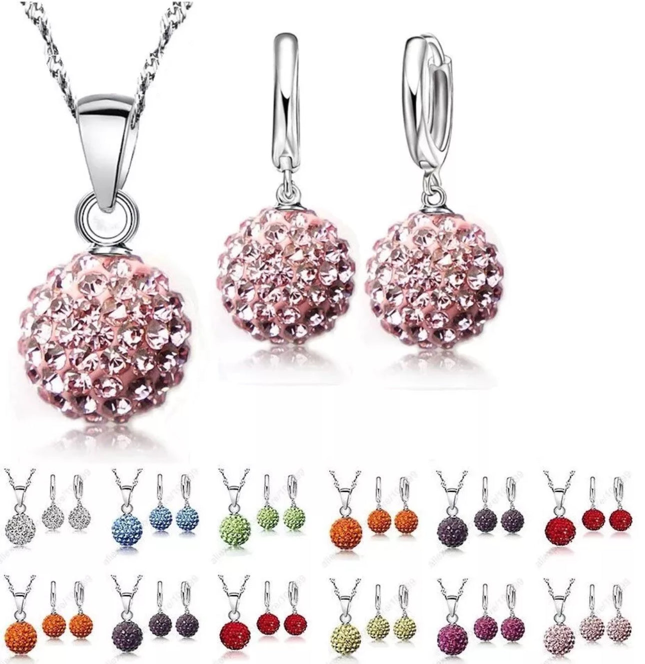 Jewelry set with pink crystal pendant and earrings on a white background