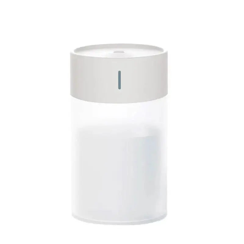White cylindrical device with a small indicator light on a white background