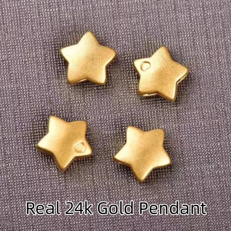 Four gold star-shaped pendants on a textured gray background with 'Real 24k Gold Pendant' text.