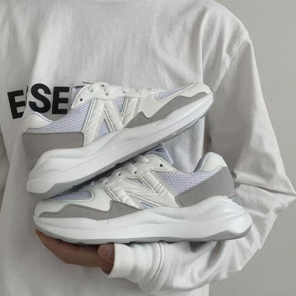 Ape Shark Grey Casual Shoes held in hands showing white grey mesh and suede panels with chunky sole