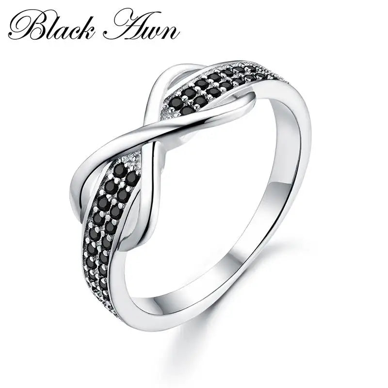 Stylish silver engagement ring for women with black and white stone accents in an infinity design