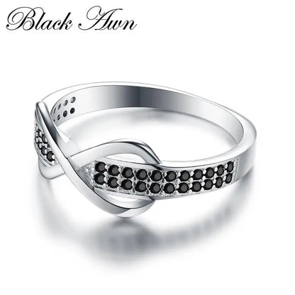 Elegant silver engagement ring for women featuring black crystal accents and a twist design