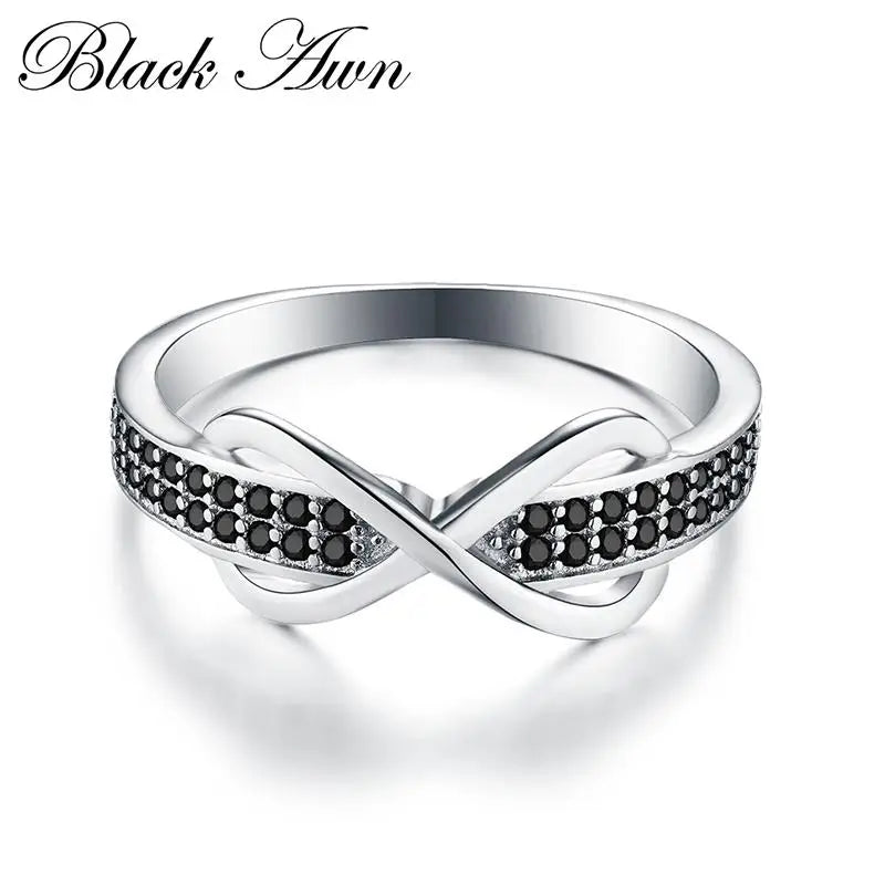Stylish silver engagement ring for women featuring an infinity design with black stones