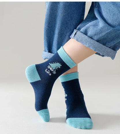 Boys cotton crew socks in navy blue with dinosaur design and turquoise accents for fun style
