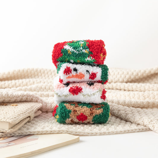 eprolo fluffy Christmas patterned thick winter home socks for children stacked on a cream knitted blanket