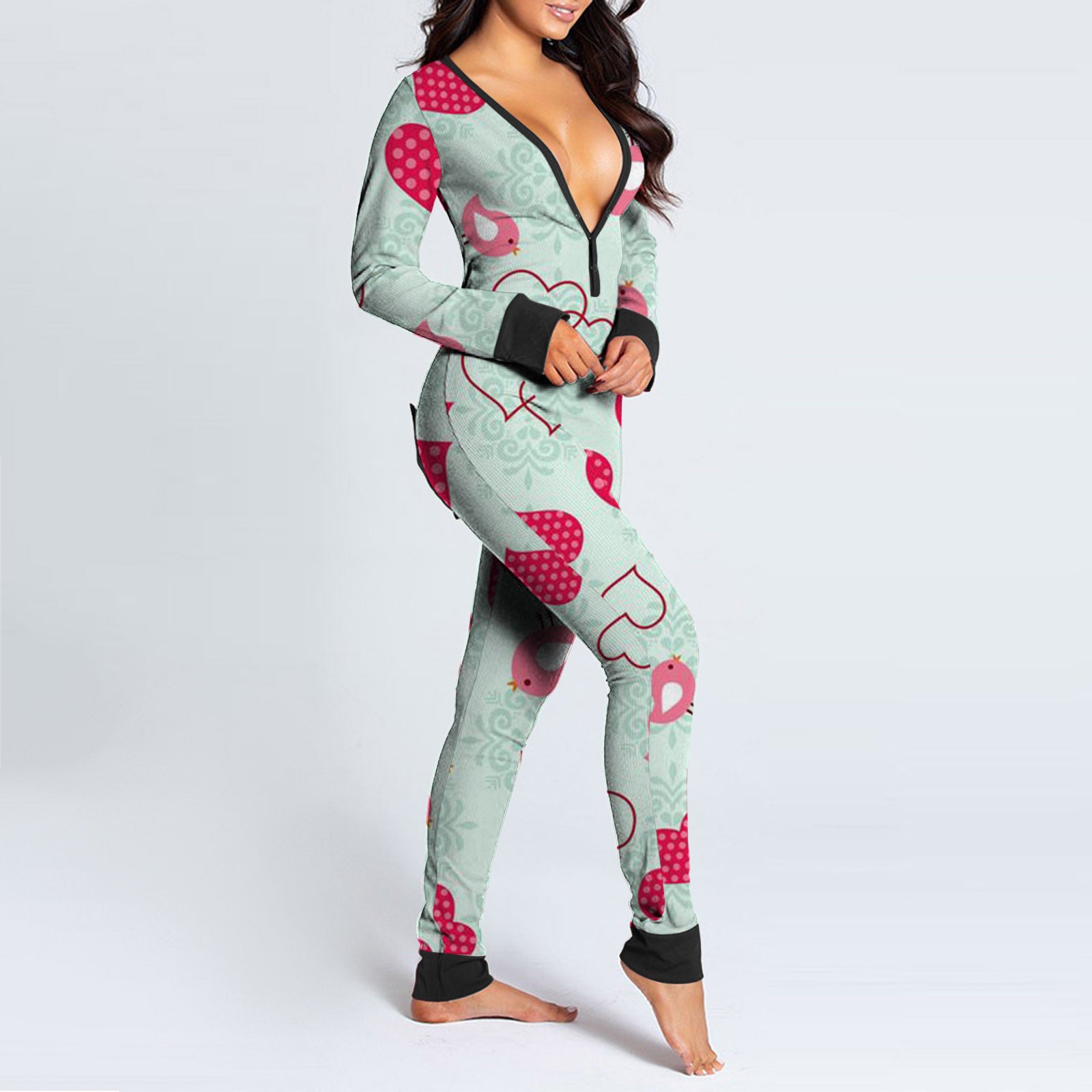 Luxurymania24 model wearing mint green patterned onesie with pink hearts and birds fun buttoned flap overalls sleep suit