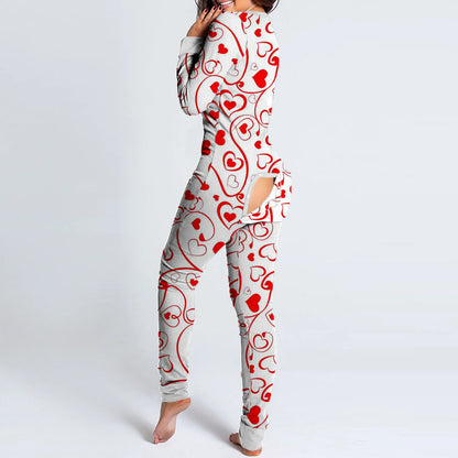 Woman wearing white onesie with red heart print and rear buttoned flap by Luxurymania24 fun buttoned flap overalls sleep suit