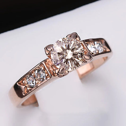 Elegant cubic zirconia wedding ring for women in rose gold with a central stone and side accents