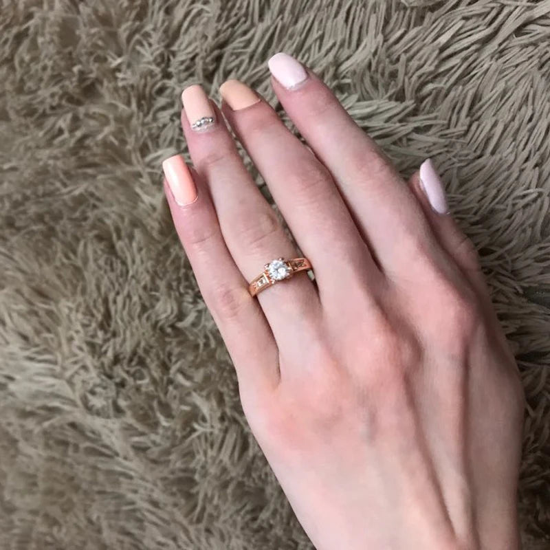 Elegant cubic zirconia wedding ring for women displayed on a hand with manicured nails