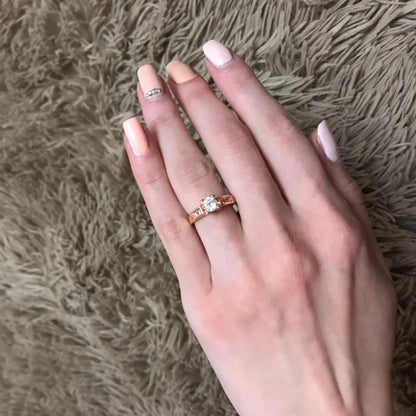 Elegant cubic zirconia wedding ring for women displayed on a hand with manicured nails