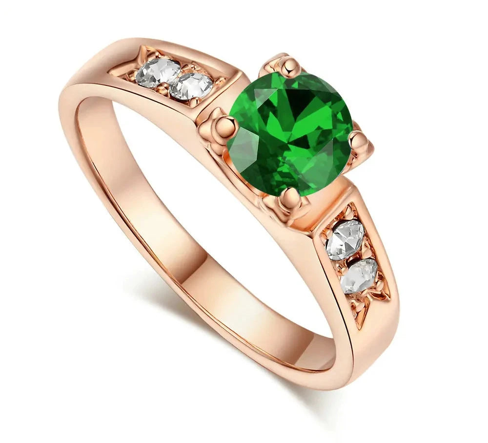 Elegant rose gold ring featuring a round green gem and cubic zirconia wedding ring for women