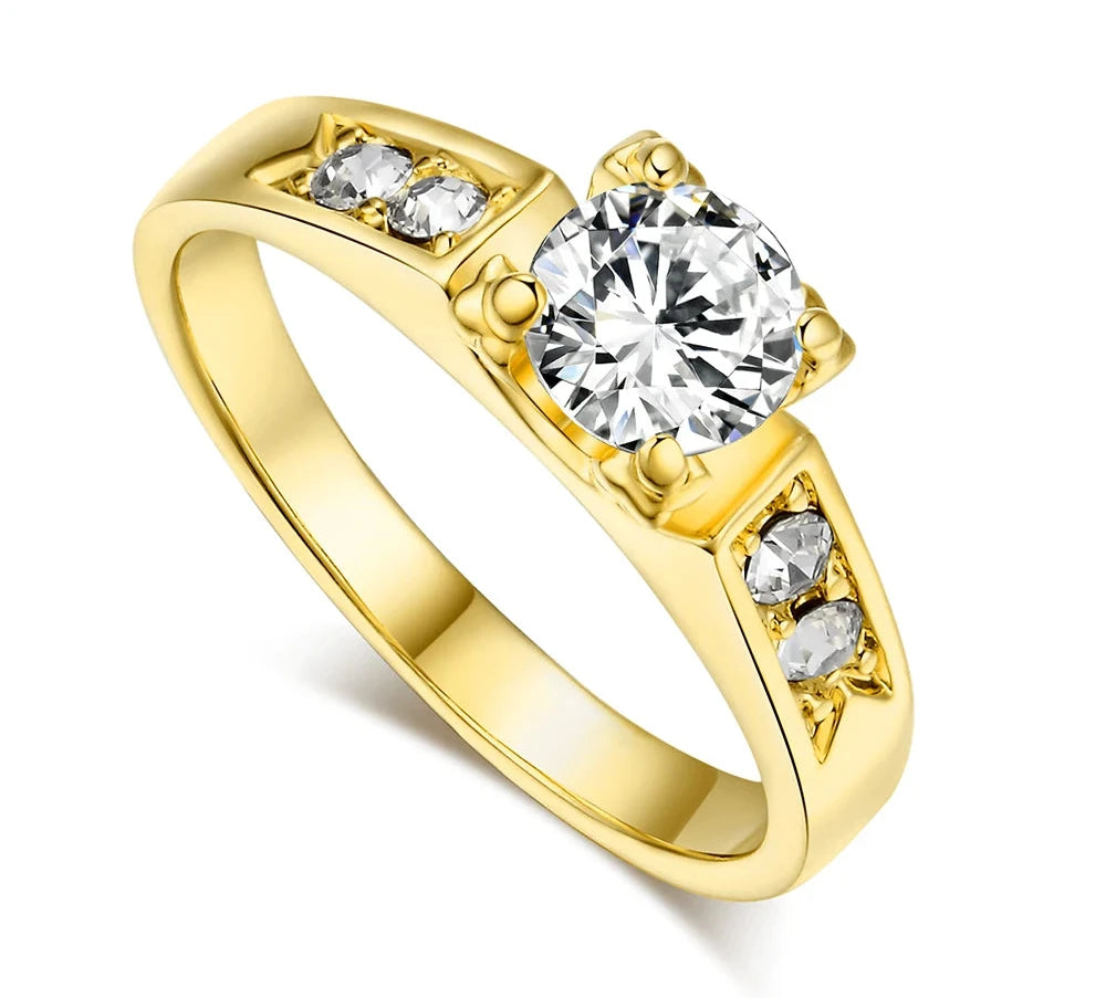 Elegant cubic zirconia wedding ring for women in gold setting with a central diamond-like stone