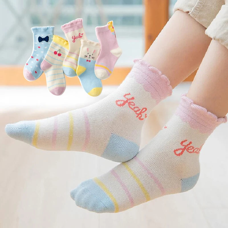 Cute kids warm socks for winter in pastel colours, featuring fun patterns and comfortable fit