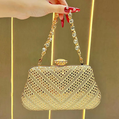 Elegant gold designer handheld shoulder bag UK with intricate pattern and beaded chain strap