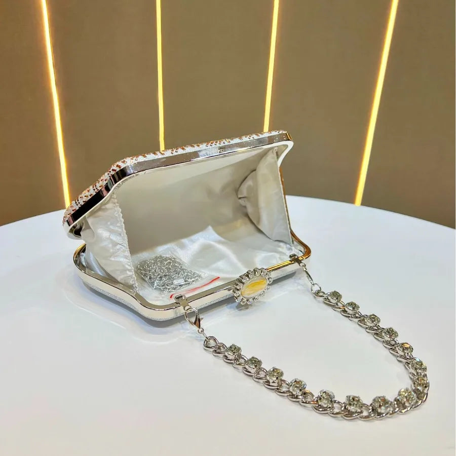 Open designer handheld shoulder bag UK with silver chain and interior lining for elegant occasions