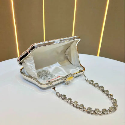 Open designer handheld shoulder bag UK with silver chain and interior lining for elegant occasions