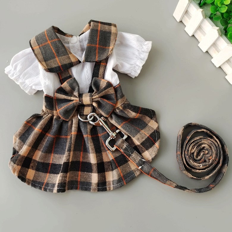 Cute dog dress with leash for small dogs in plaid design with a bow and matching colours