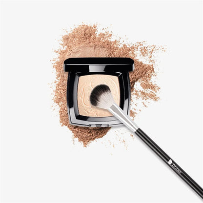 DUcare highlighter brush applying powder on a smooth makeup surface for a flawless finish