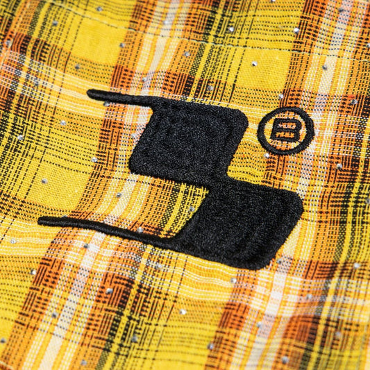 Street Style Diamond Embroidery Shirt close up of yellow plaid fabric with black embroidered logo and crystal studs