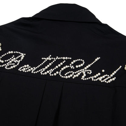 Black eprolo shirt back with pearl bead script across yoke offering an elevated street style beaded shirt look