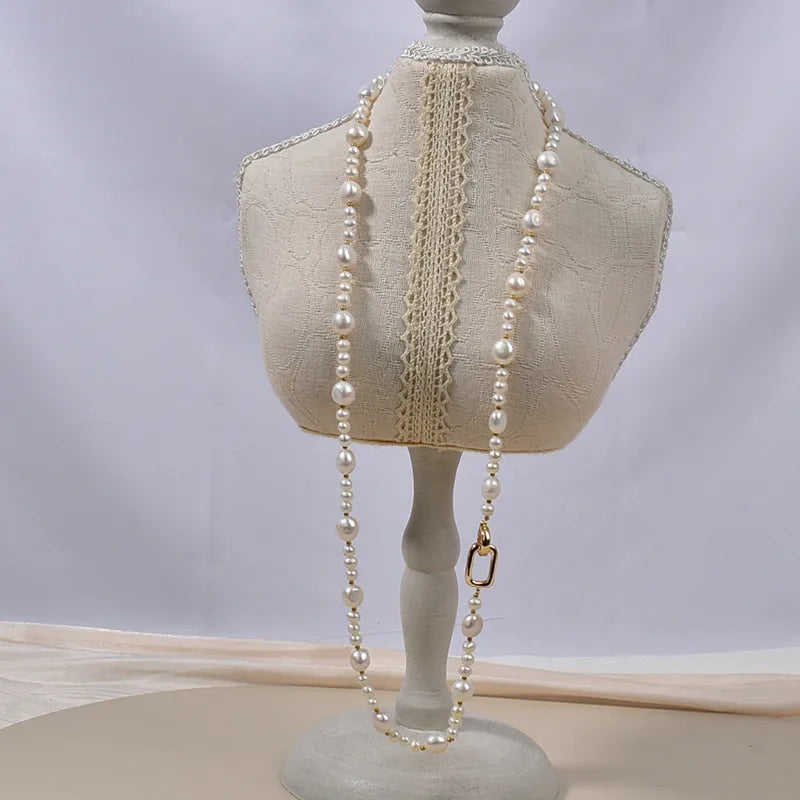 Elegant handmade freshwater pearl necklace for women displayed on a dress form, showcasing its unique design