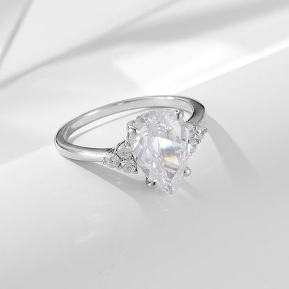 Luxurymania24 pear shaped VVS1 Moissanite Ring For Women with raindrop design and side accent stones on silver band
