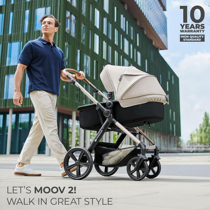 Man walking in city pushing Kinderkraft MOOV2 AIR pram set beige with modern building backdrop and 10 year warranty