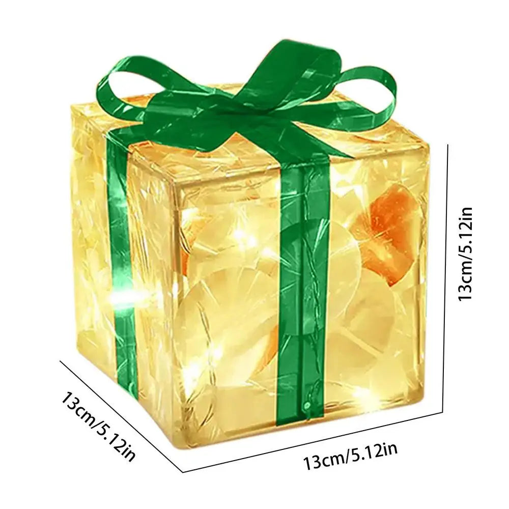 LED Christmas box ornaments with green ribbon and warm glow for festive holiday decor